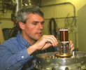 Scientist
            working on magnetic cooling system.